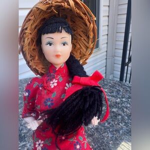 Vintage Chinese Doll In Traditional red Floral Clothing and A Conical Straw Hat